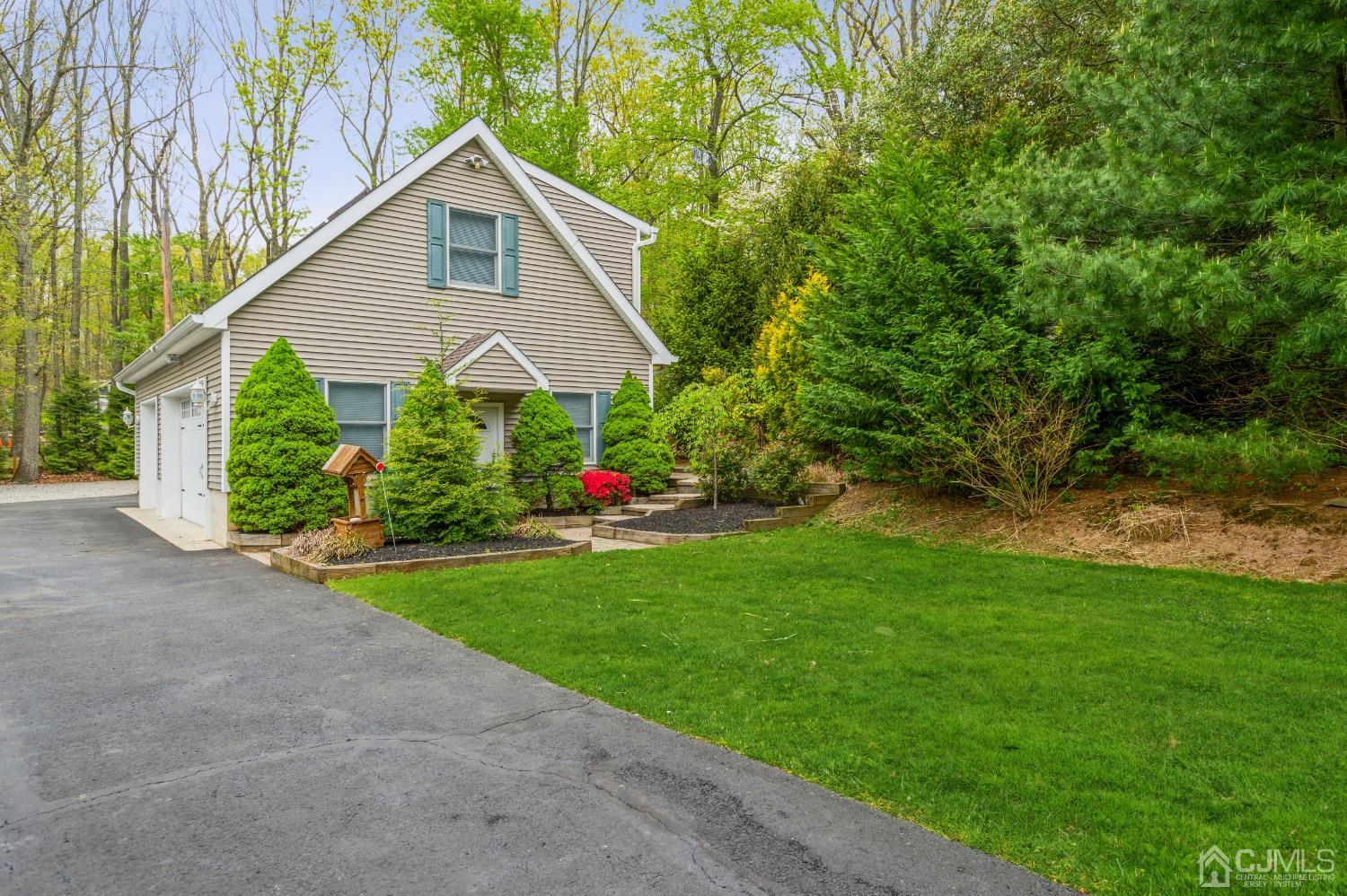 44 Chambers Road Cream Ridge, NJ 08514 - Photo 23 of 27 a front view of a house with garden