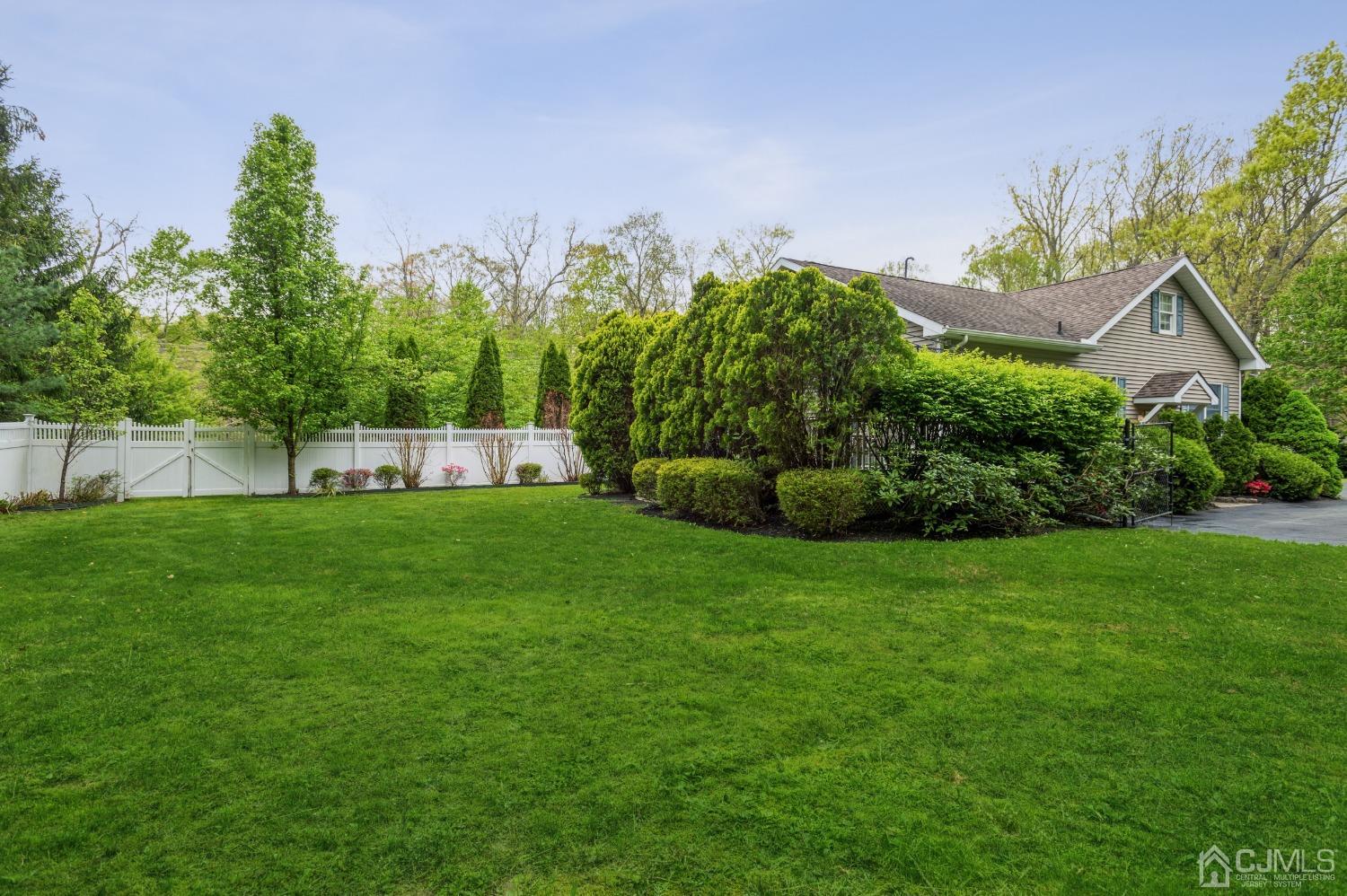 44 Chambers Road Cream Ridge, NJ 08514 - Photo 25 of 27 a view of a garden with a building in the background