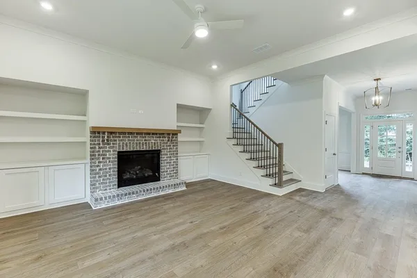 a view of kitchen with sink microwave and stove