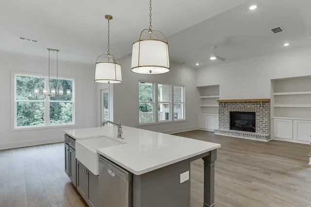 a view of room window and hardwood floor