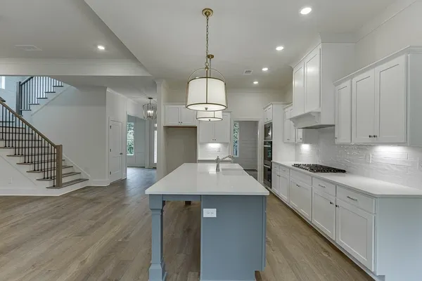 a view of a livingroom and a hallway