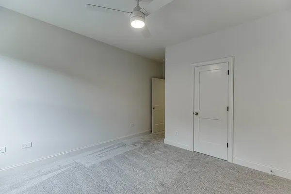 a bathroom with double vanity sinks and a mirror