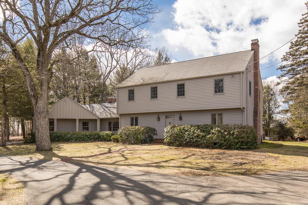 874 Racebrook Road Orange, CT 06477 - Photo 1 of 1 a front view of a house with a yard