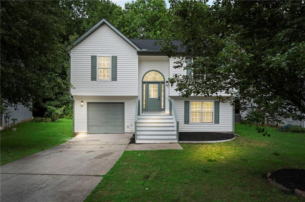 3602 Bristol Overlook Rex, GA 30273 - Photo 2 of 37 a front view of a house with a yard
