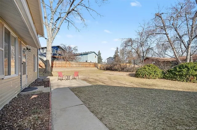 a view of a street with trees on both side of it