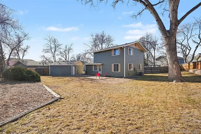 a view of a house with snow on the road