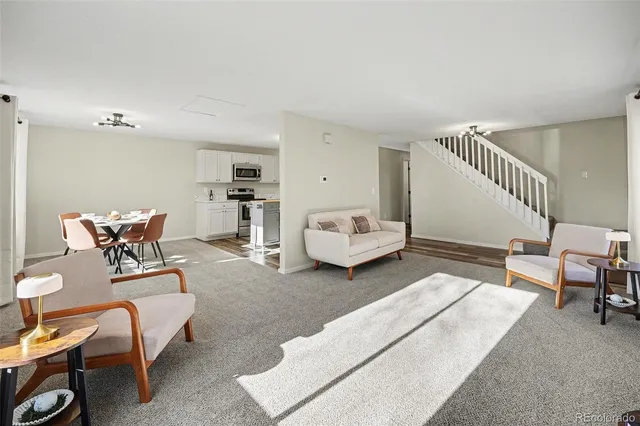 a living room with furniture and a chair