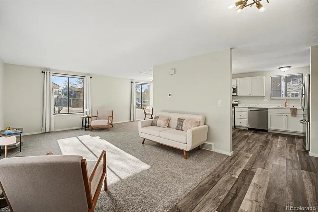 a living room with furniture and a table