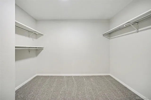 a view of a room with shelf on the wall