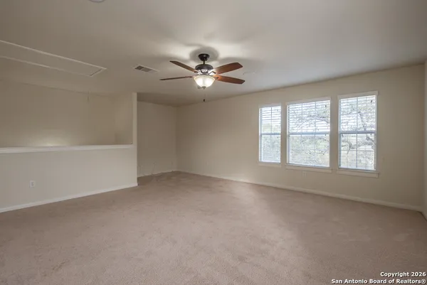 a view of an empty room with a window