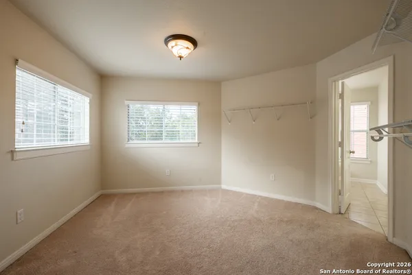 a bathroom with a granite countertop sink mirror and