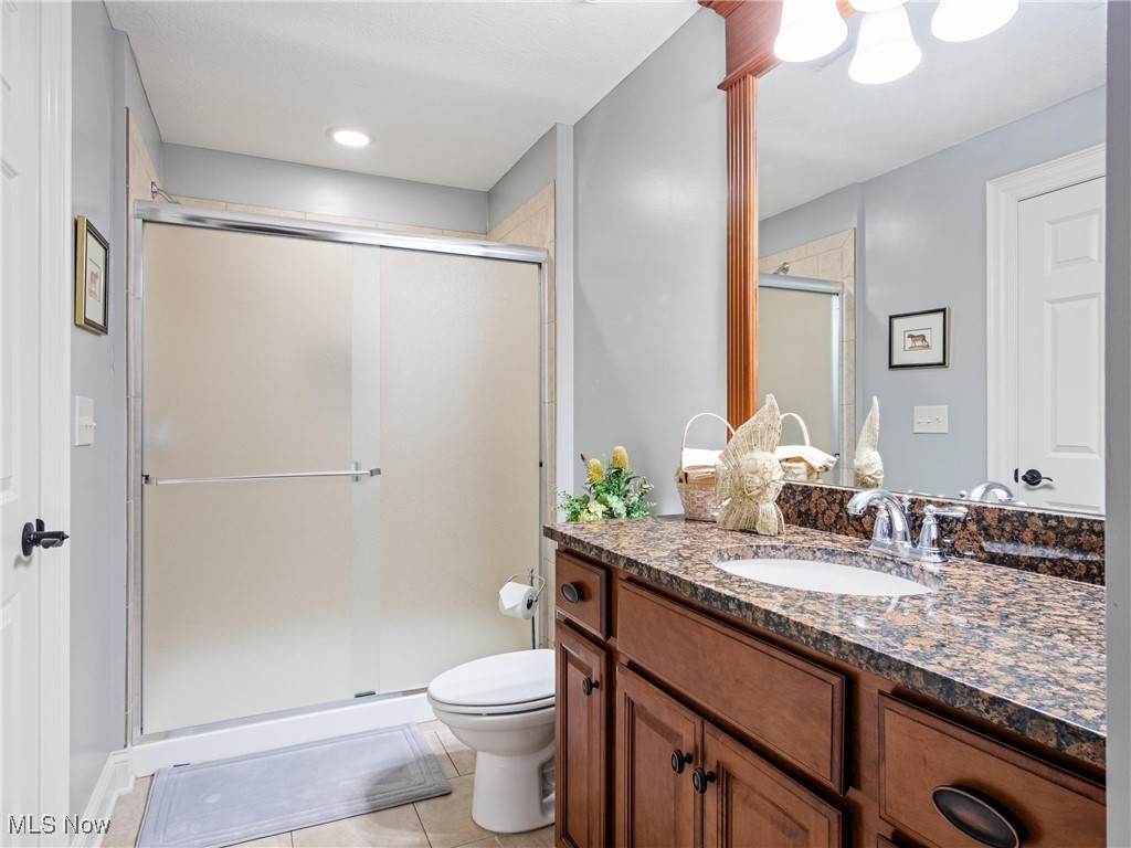5349 Slater Ridge Westerville, OH 43082 - Photo 36 of 50 Full bath featuring a stall shower, light tile patterned floors, and vanity