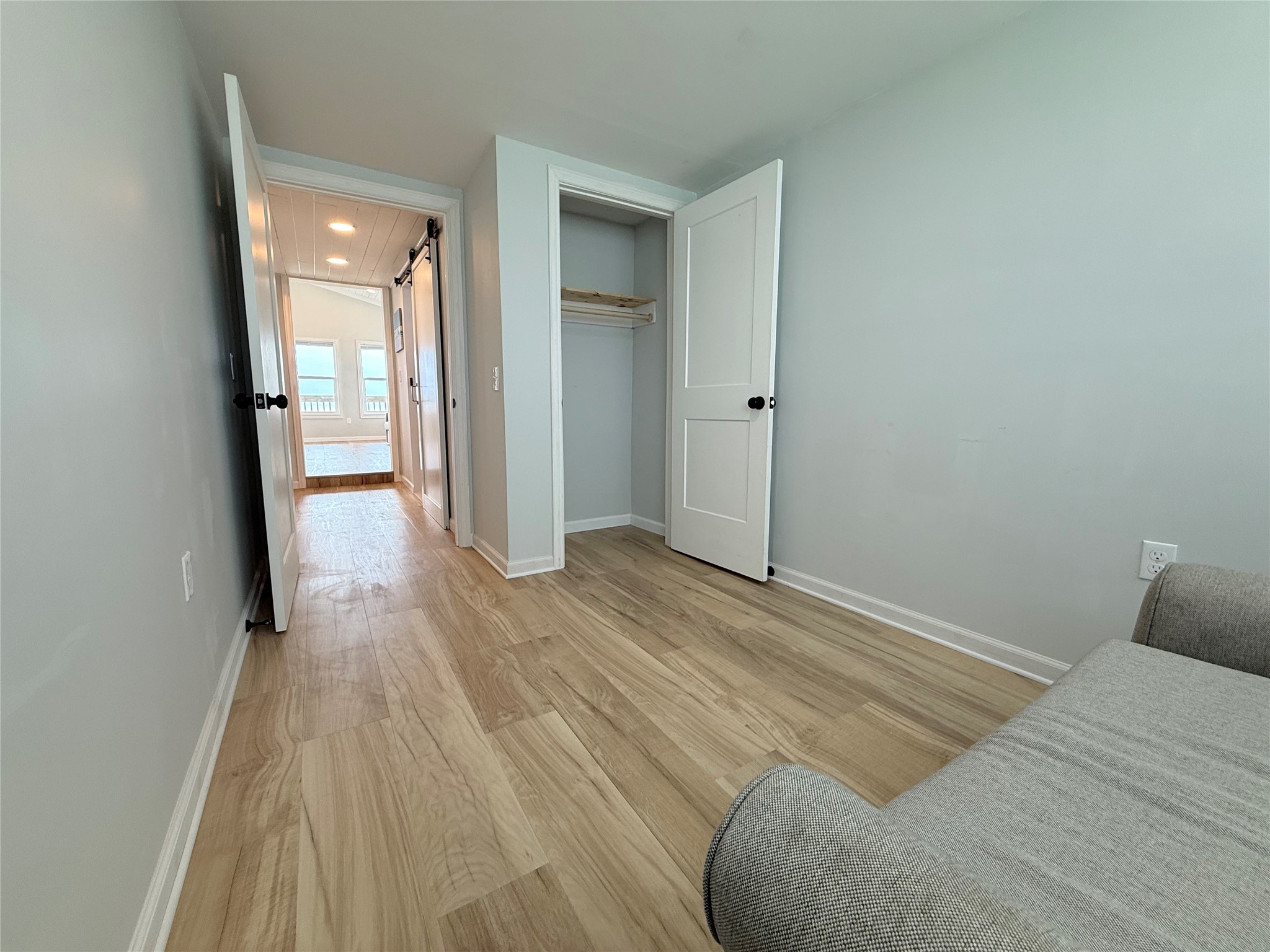 2154 County Road 230 Sargent, TX 77414 - Photo 27 of 30 a view of a bedroom with wooden floor