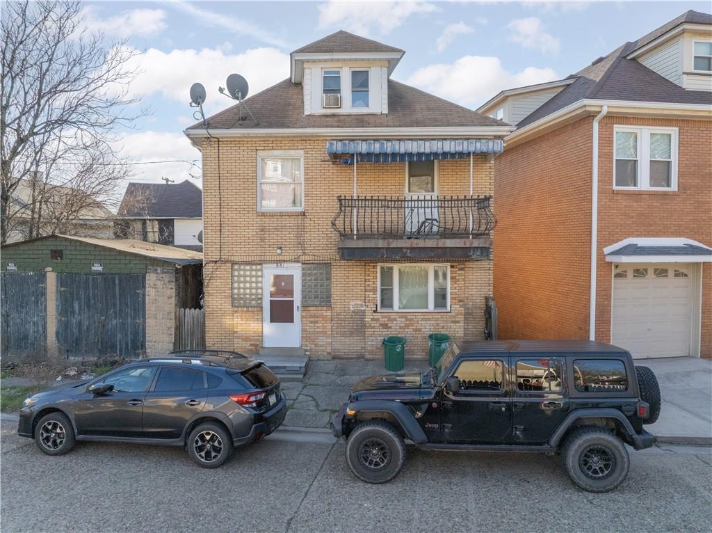 a car parked in front of a house