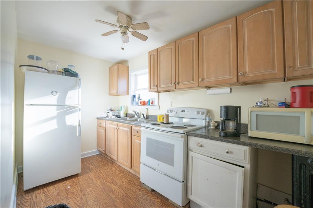 881 Lenz Avenue Ambridge, PA 15003 - Photo 15 of 30 a kitchen with stainless steel appliances granite countertop a refrigerator sink and cabinets