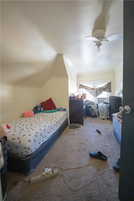 881 Lenz Avenue Ambridge, PA 15003 - Photo 23 of 30 a bedroom with a bed and a chandelier