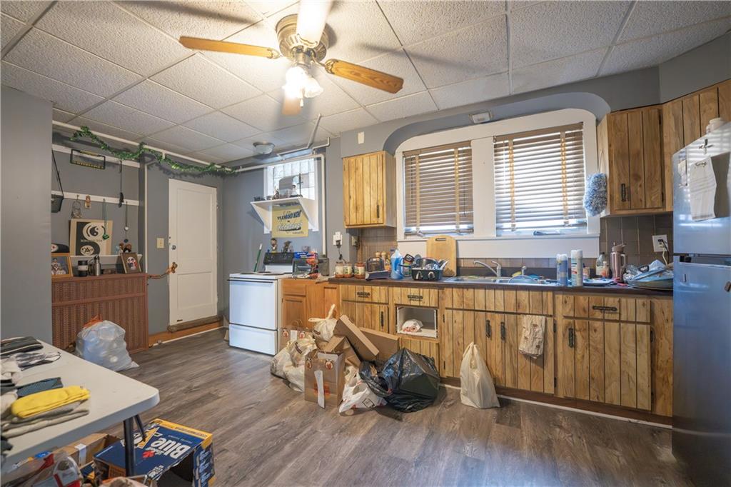 881 Lenz Avenue Ambridge, PA 15003 - Photo 7 of 30 a very nice looking kitchen with granite countertop a stove a sink a refrigerator dining table and chairs