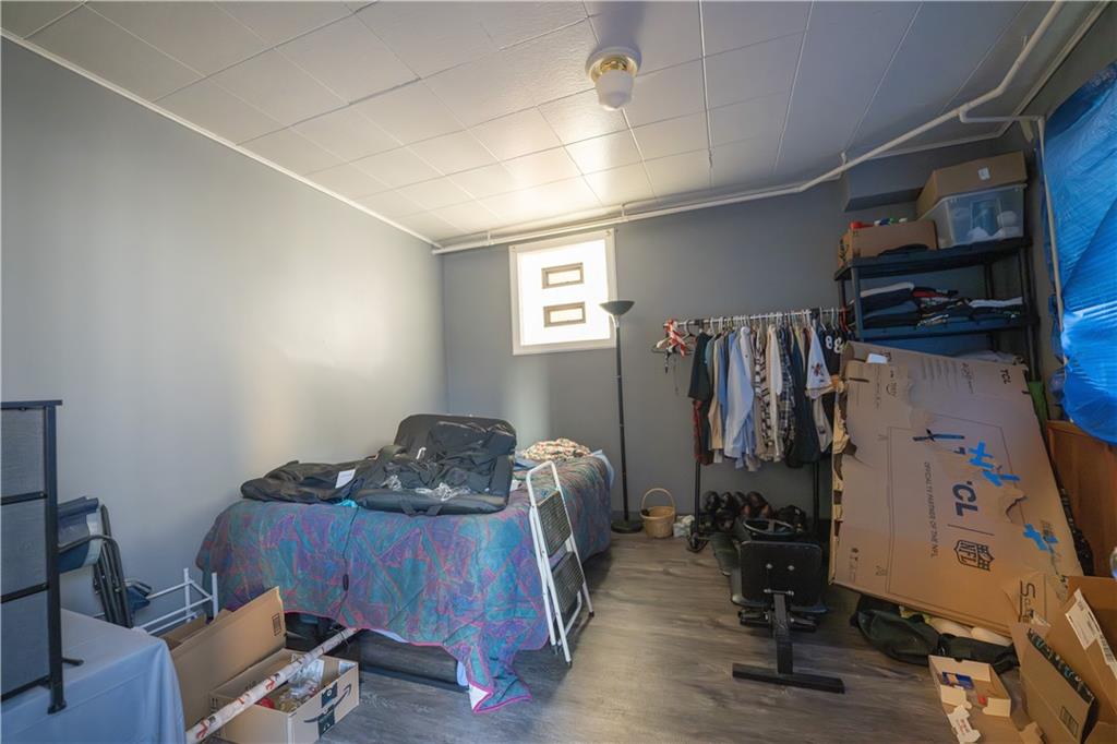 881 Lenz Avenue Ambridge, PA 15003 - Photo 10 of 30 a room with furniture and wooden floor