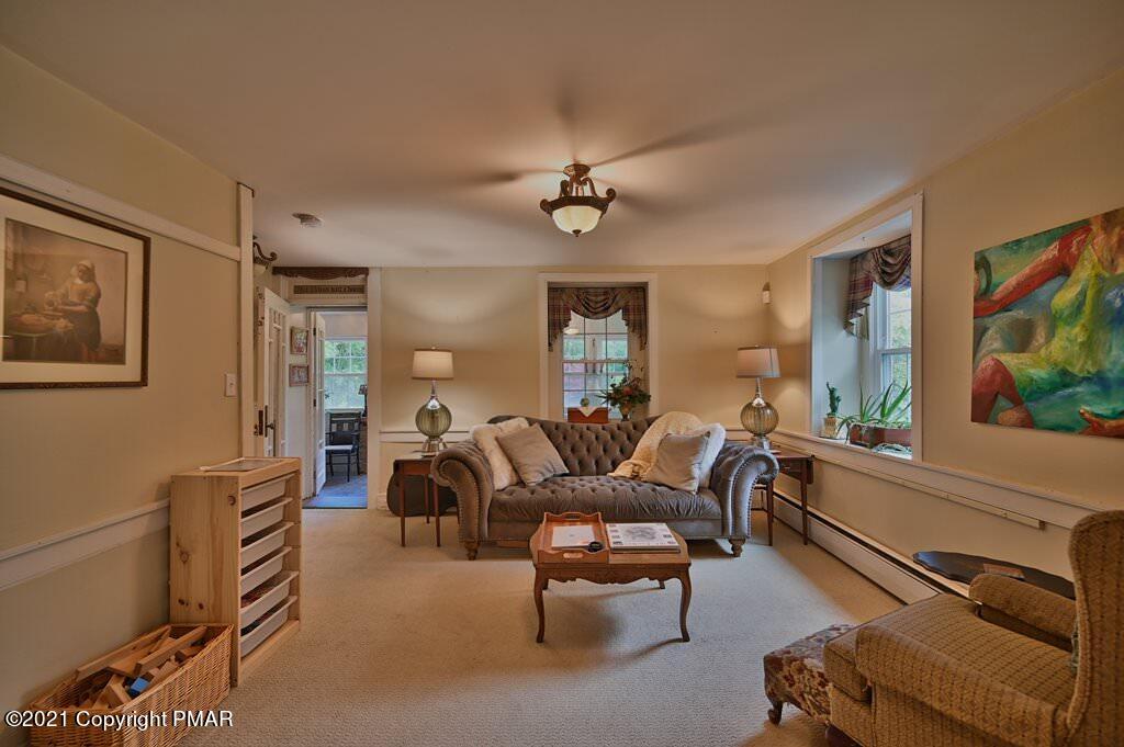259 Hay Road Stroudsburg, PA 18360 - Photo 16 of 137 a living room with furniture a ceiling fan and a window