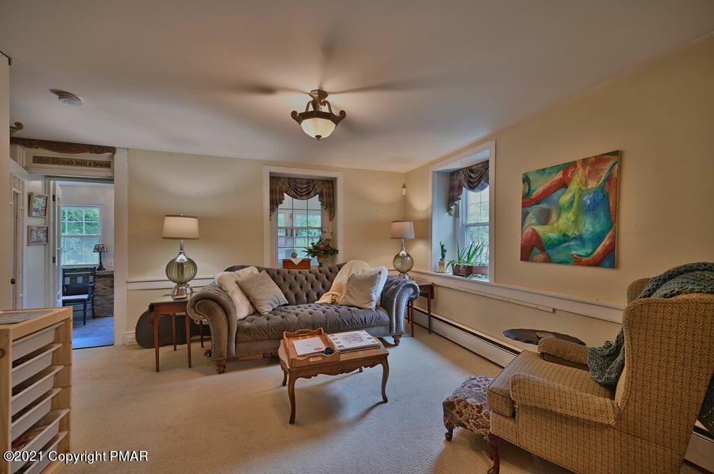 259 Hay Road Stroudsburg, PA 18360 - Photo 17 of 137 a living room with furniture a ceiling fan and a window