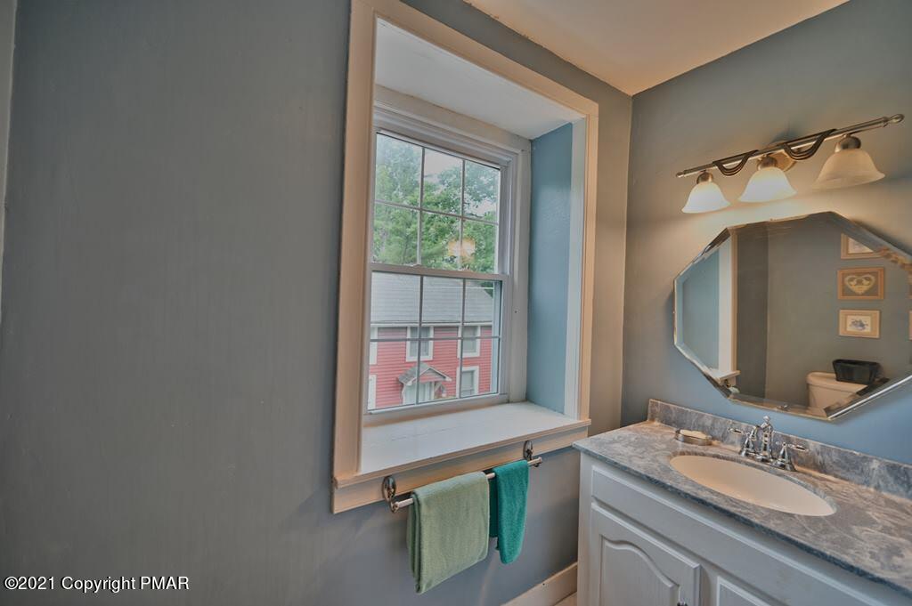 259 Hay Road Stroudsburg, PA 18360 - Photo 44 of 137 a bathroom with a granite countertop sink and a mirror