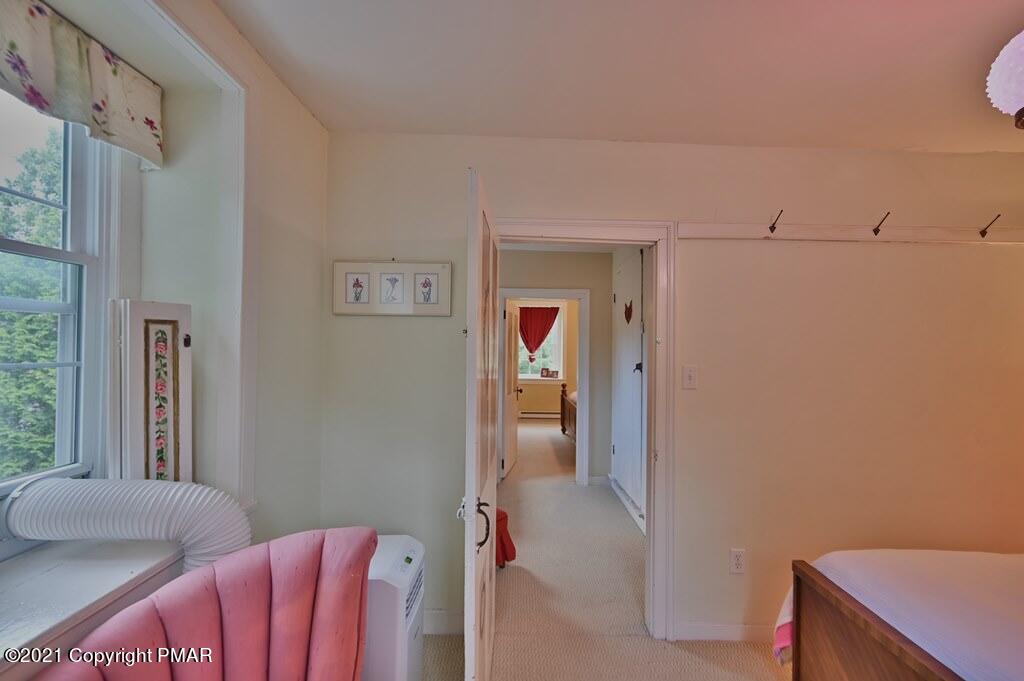 259 Hay Road Stroudsburg, PA 18360 - Photo 50 of 137 a bedroom with a bed and a desk