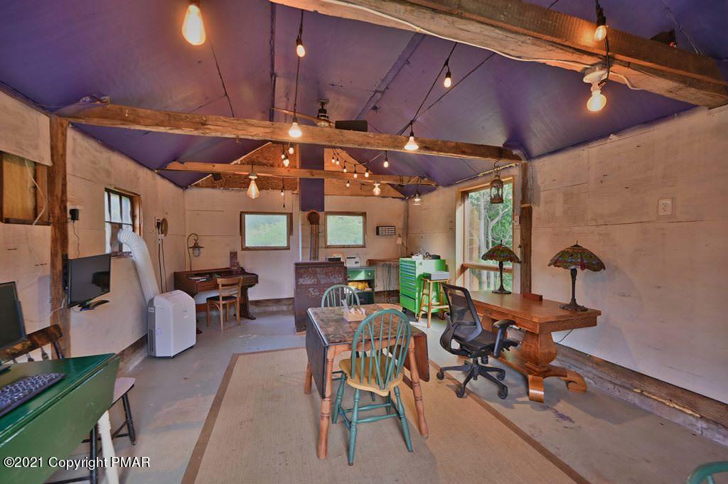 259 Hay Road Stroudsburg, PA 18360 - Photo 79 of 137 a view of a patio with table and chairs with wooden floor
