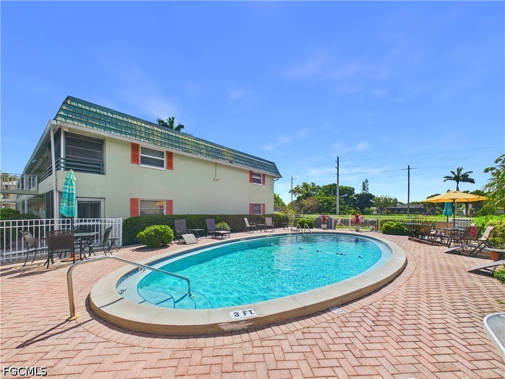 300 Valley Stream Drive, Unit 3D Naples, FL 34113 - Photo 21 of 21 a view of a swimming pool with a patio