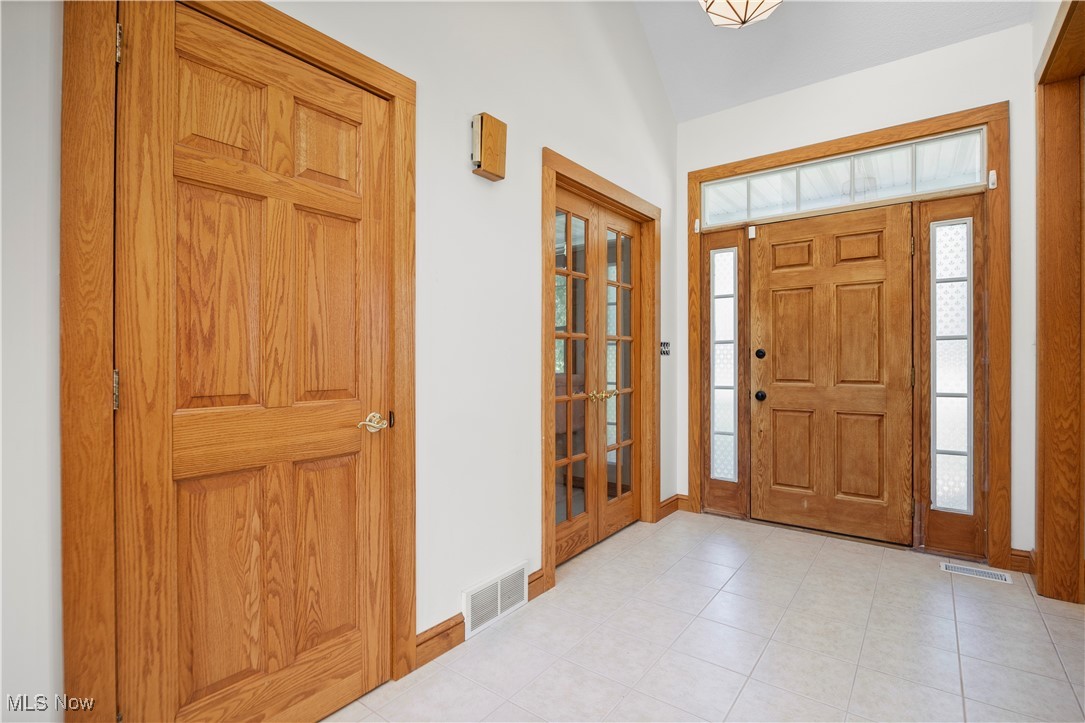 5310 Billings Road Castalia, OH 44824 - Photo 16 of 50 Entryway with french doors and light tile patterned floors