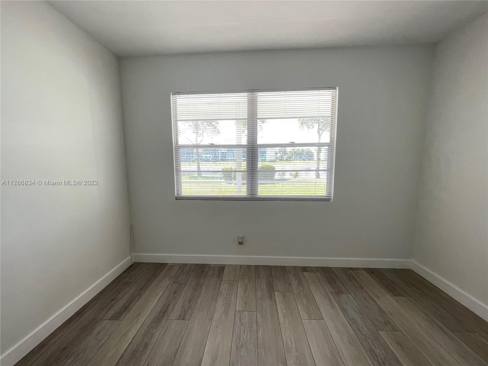 1084 Guildford East Boca Raton, FL 33434 - Photo 27 of 34 an empty room with a window