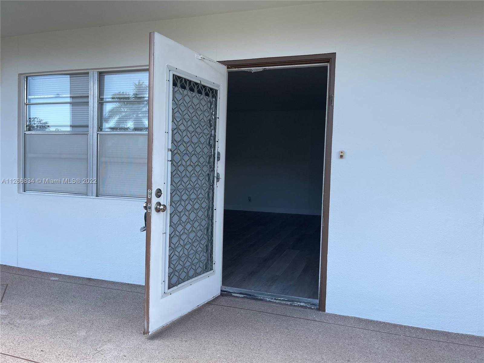 1084 Guildford East Boca Raton, FL 33434 - Photo 3 of 34 a view of an entryway door