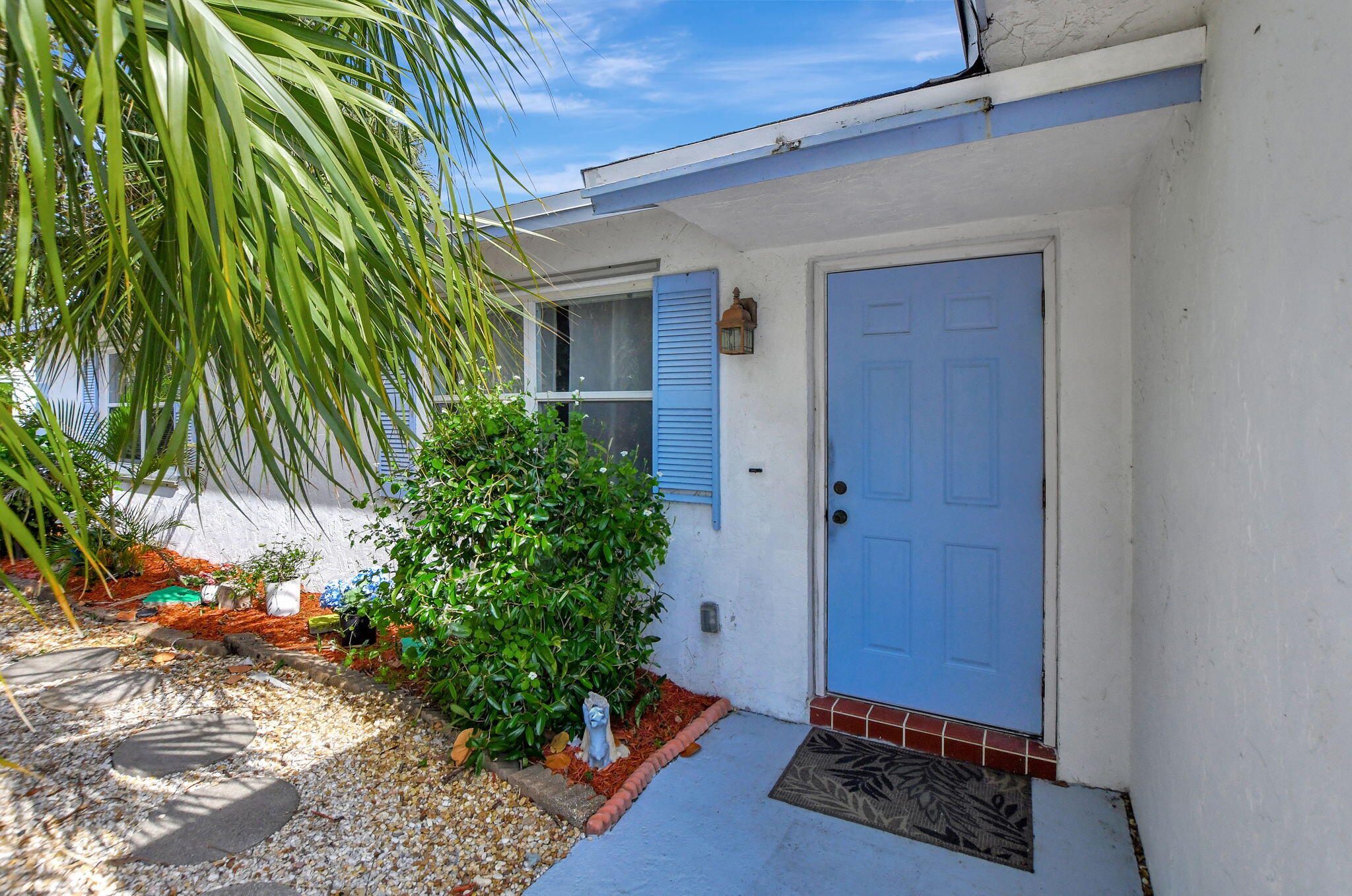 361 Forsyth Street Boca Raton, FL 33487 - Photo 3 of 49 a house with a plant in front of it