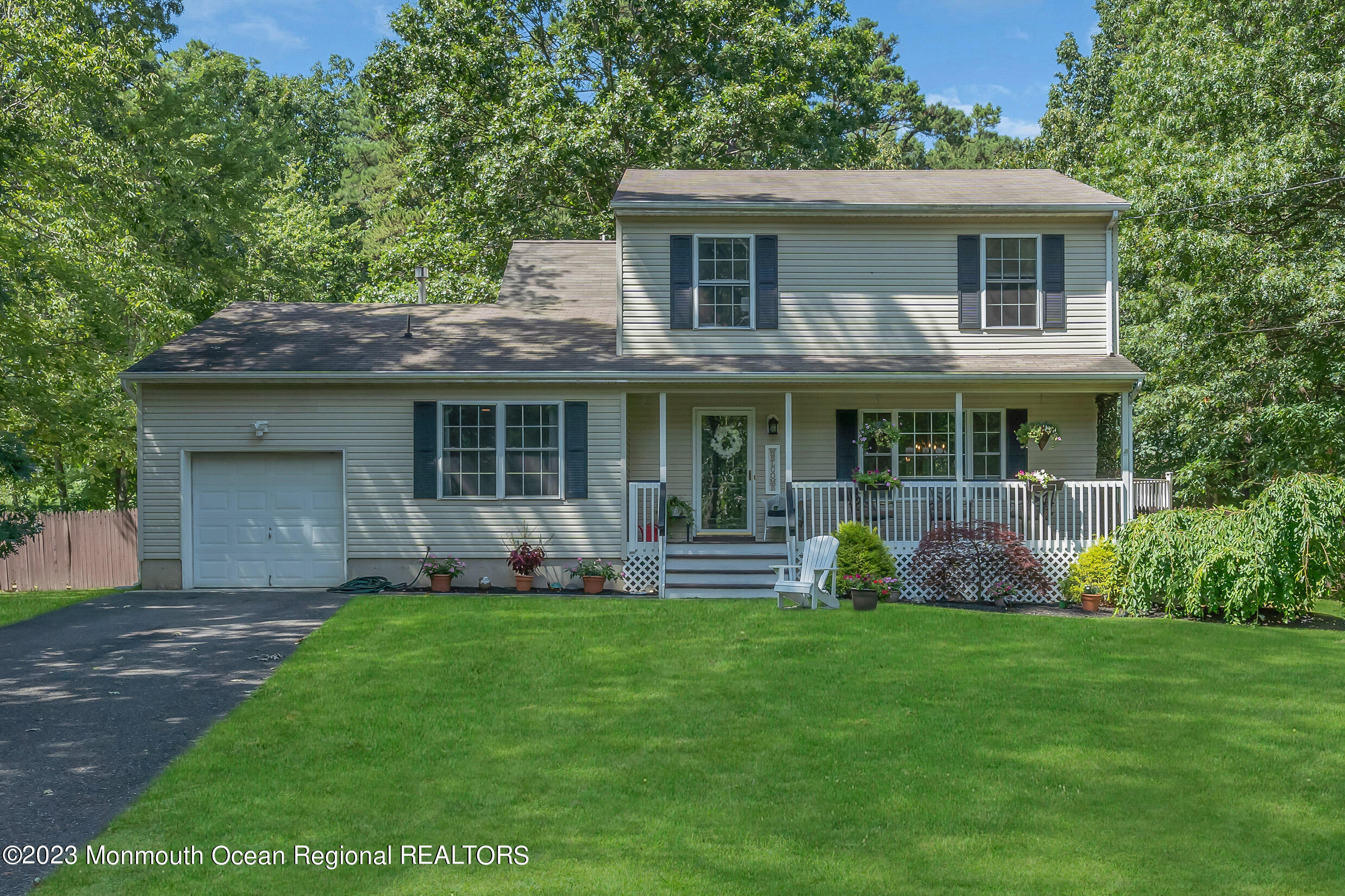 505 Leesville Road Jackson, NJ 08527 - Photo 1 of 58 a front view of a house with a yard and garden