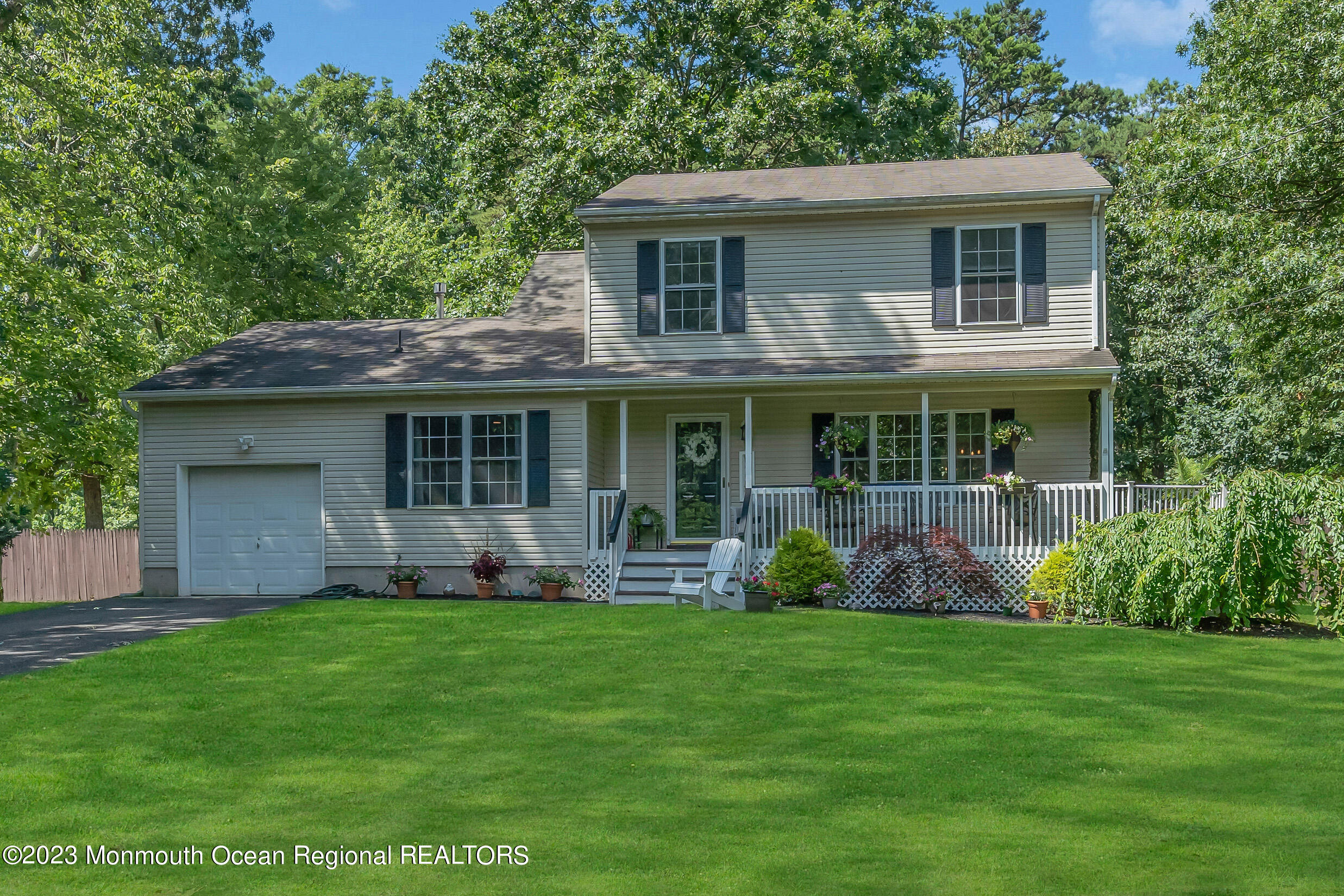 505 Leesville Road Jackson, NJ 08527 - Photo 3 of 58 a front view of a house with garden and porch