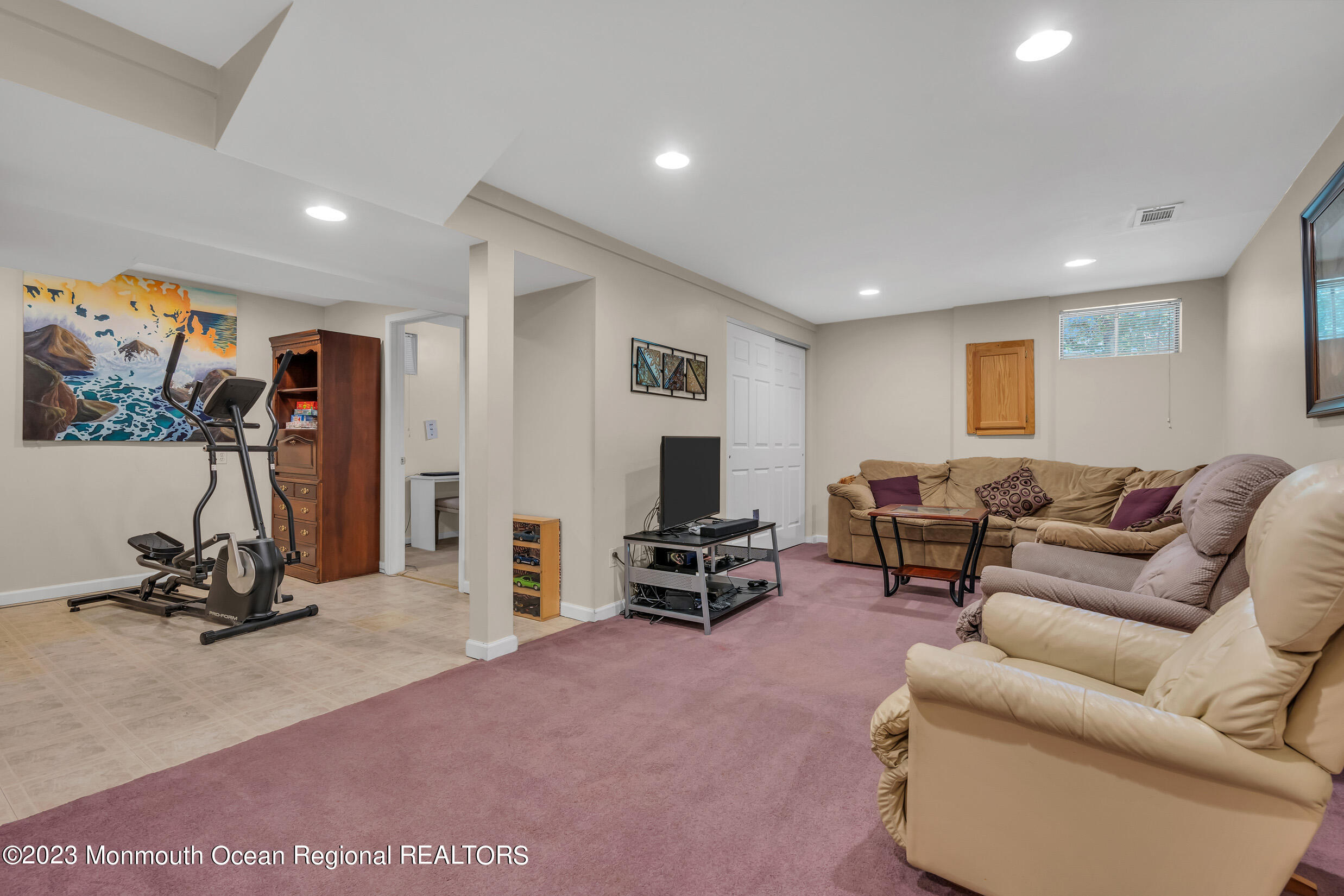 505 Leesville Road Jackson, NJ 08527 - Photo 33 of 58 a living room with furniture and a flat screen tv