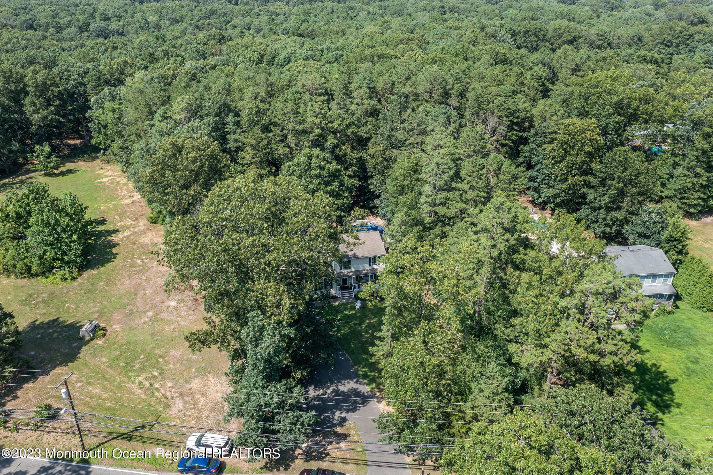505 Leesville Road Jackson, NJ 08527 - Photo 56 of 58 a view of a yard with plants and large trees