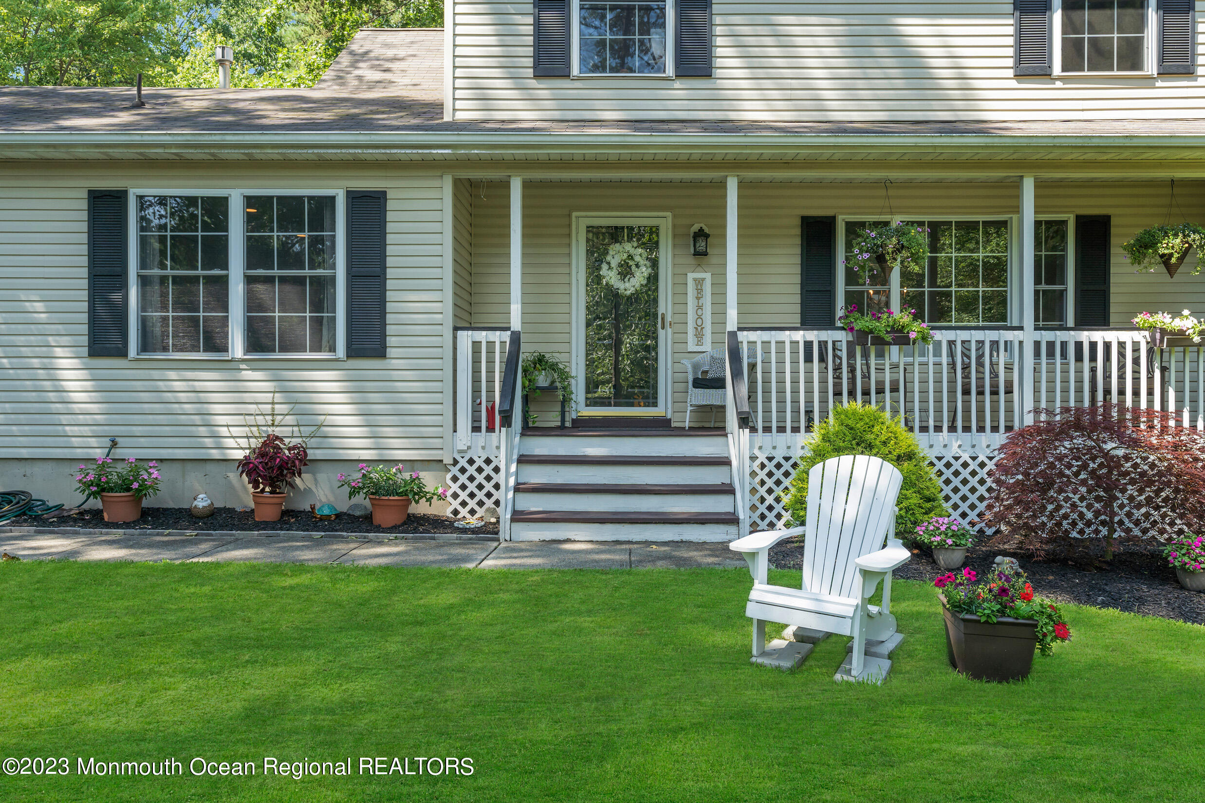 505 Leesville Road Jackson, NJ 08527 - Photo 8 of 58 a front view of a house with a garden and chairs