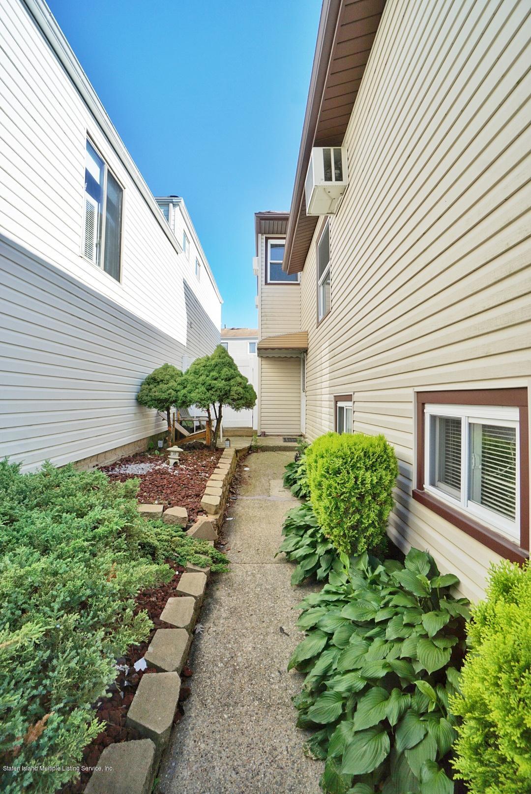 241 Green Valley Road Staten Island, NY 10312 - Photo 3 of 44 Side walkway
