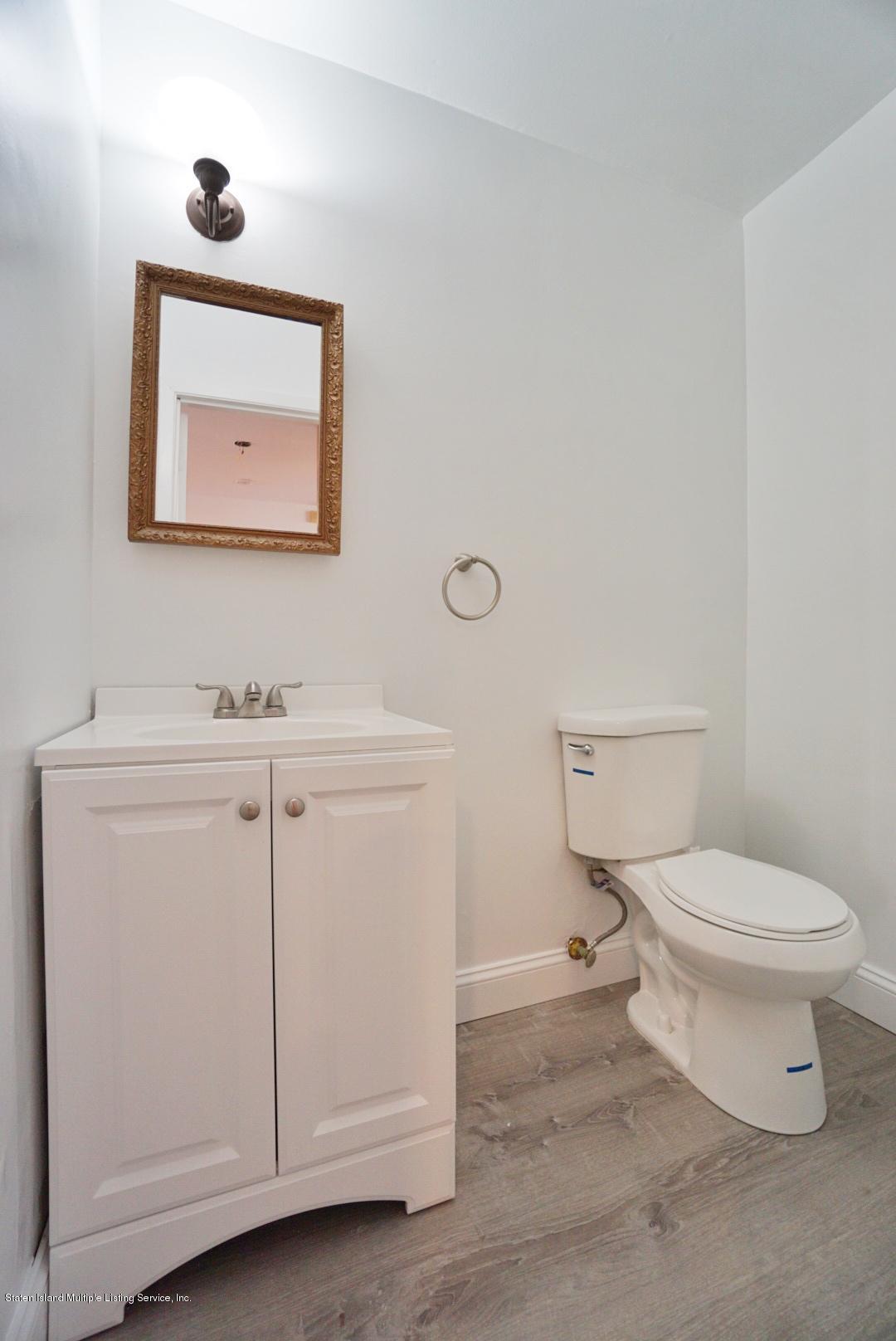 241 Green Valley Road Staten Island, NY 10312 - Photo 8 of 44 Half bath in family room