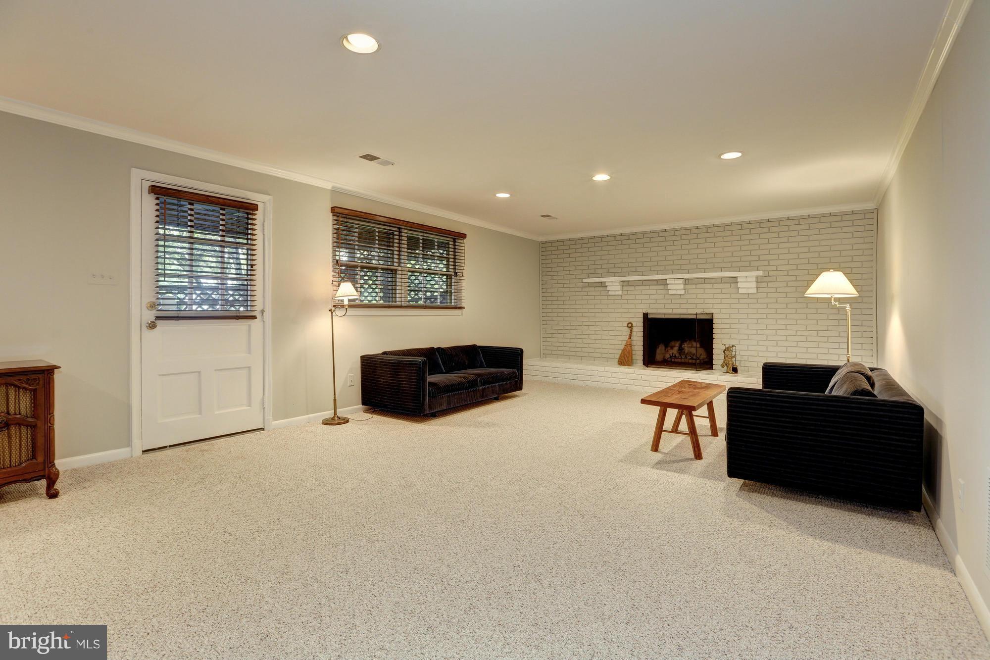 10005 Kendale Road Potomac, MD 20854 - Photo 25 of 30 Walk out recreation room with fireplace
