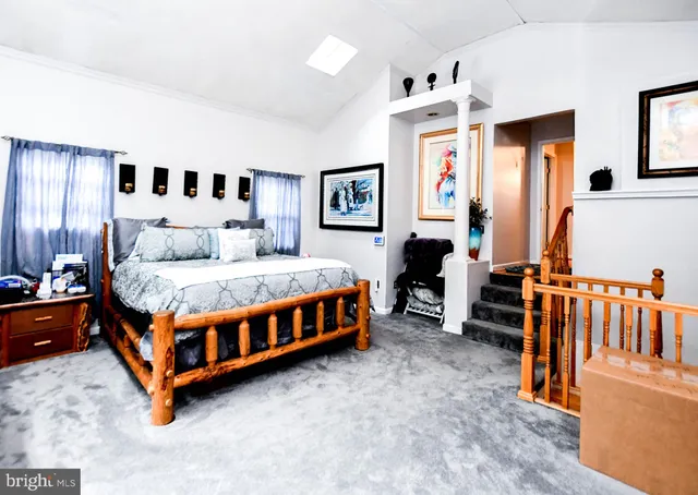 a bedroom with furniture and window