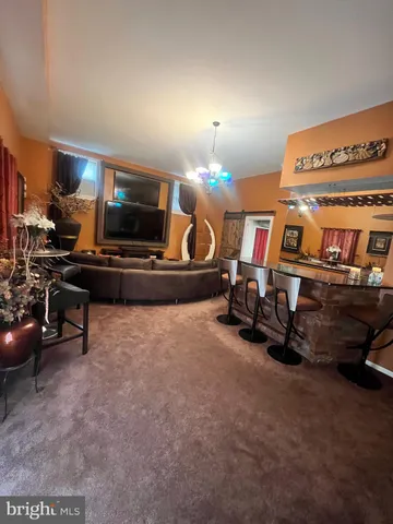 a room with gym equipment and a flat screen tv