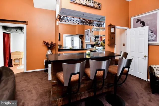 a dining room with furniture and window