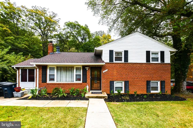 a front view of a house with yard