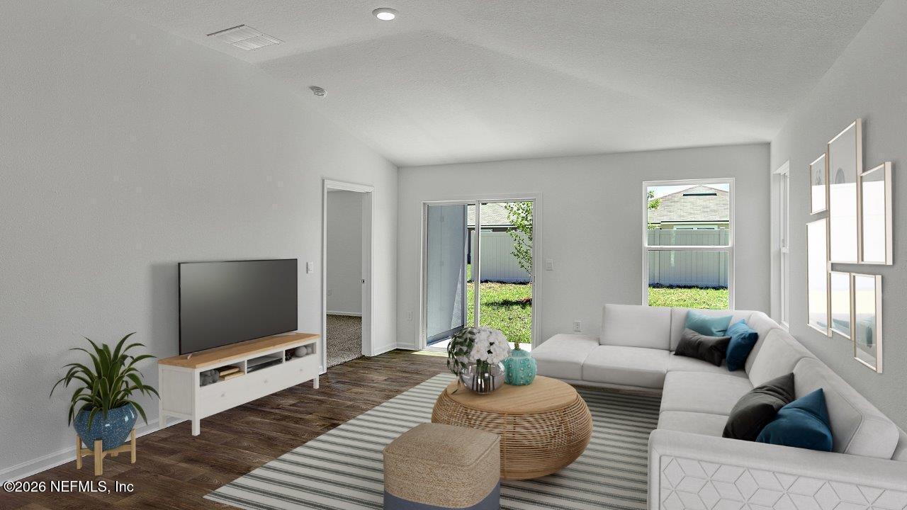 1 Divot Place Bunnell, FL 32110 - Photo 11 of 57 a living room with furniture and a flat screen tv