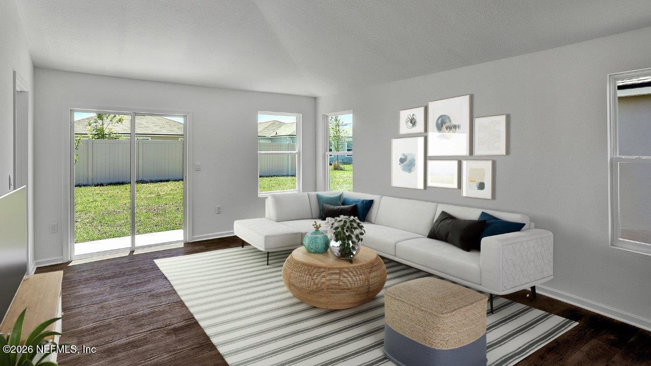 1 Divot Place Bunnell, FL 32110 - Photo 9 of 57 a living room with furniture and a large window