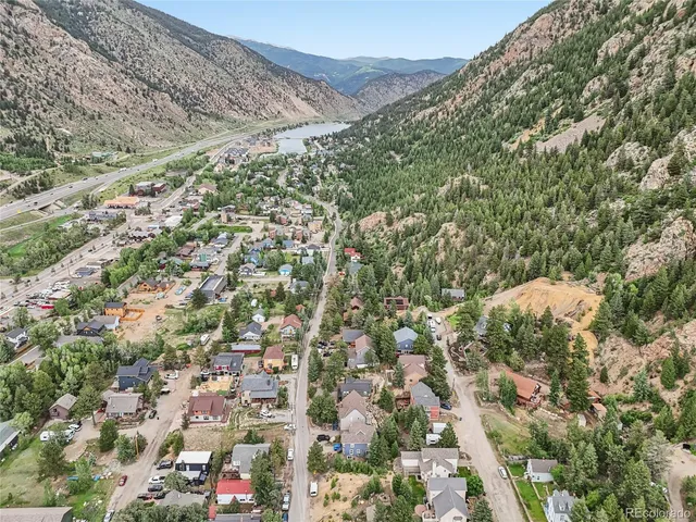 an aerial view of residential house and sandy dunes