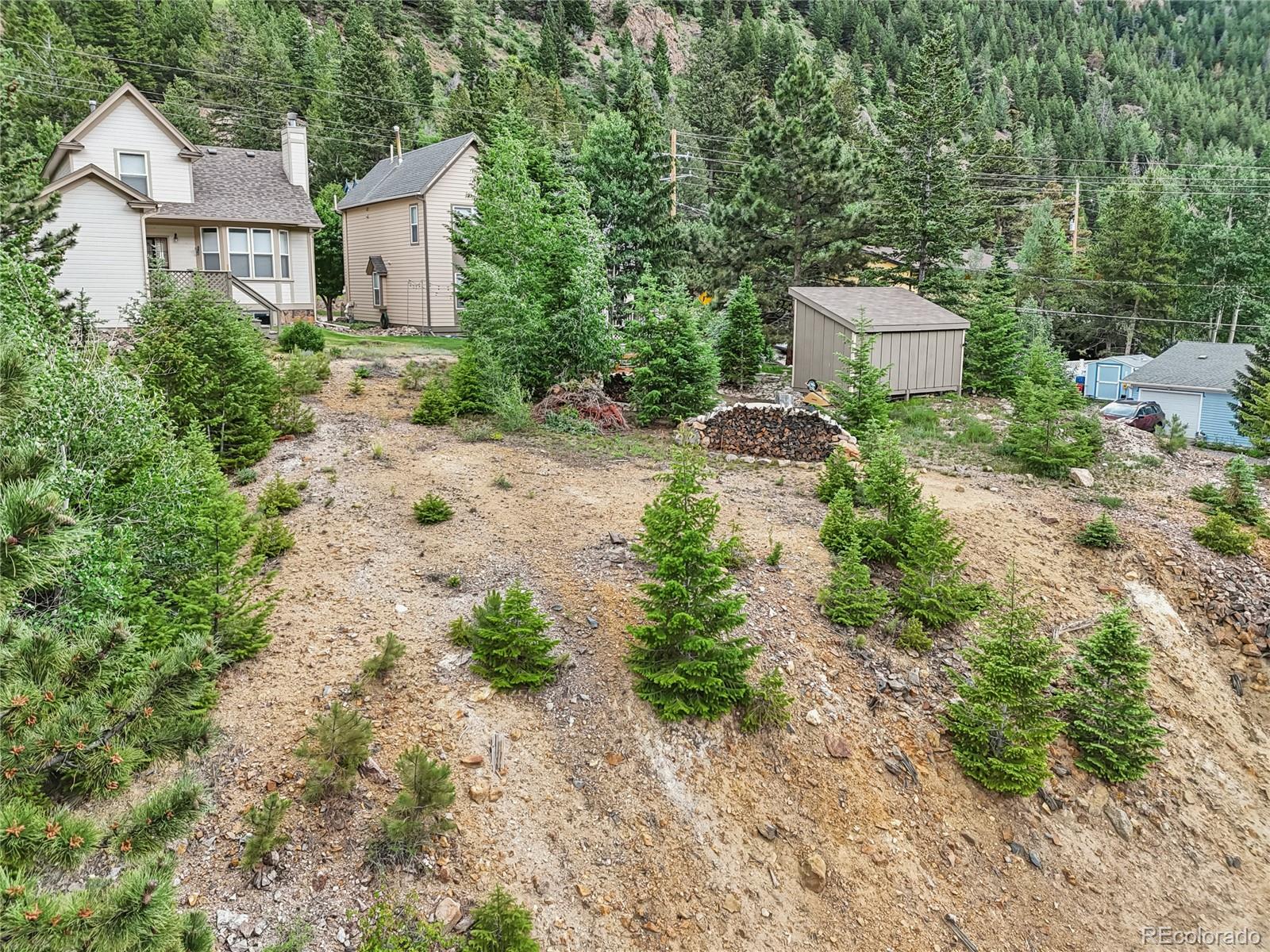 0 Main Street Georgetown, CO 80444 - Photo 7 of 15 a view of a house with a yard and large trees