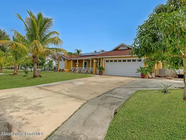 a view of house with outdoor space and swimming pool