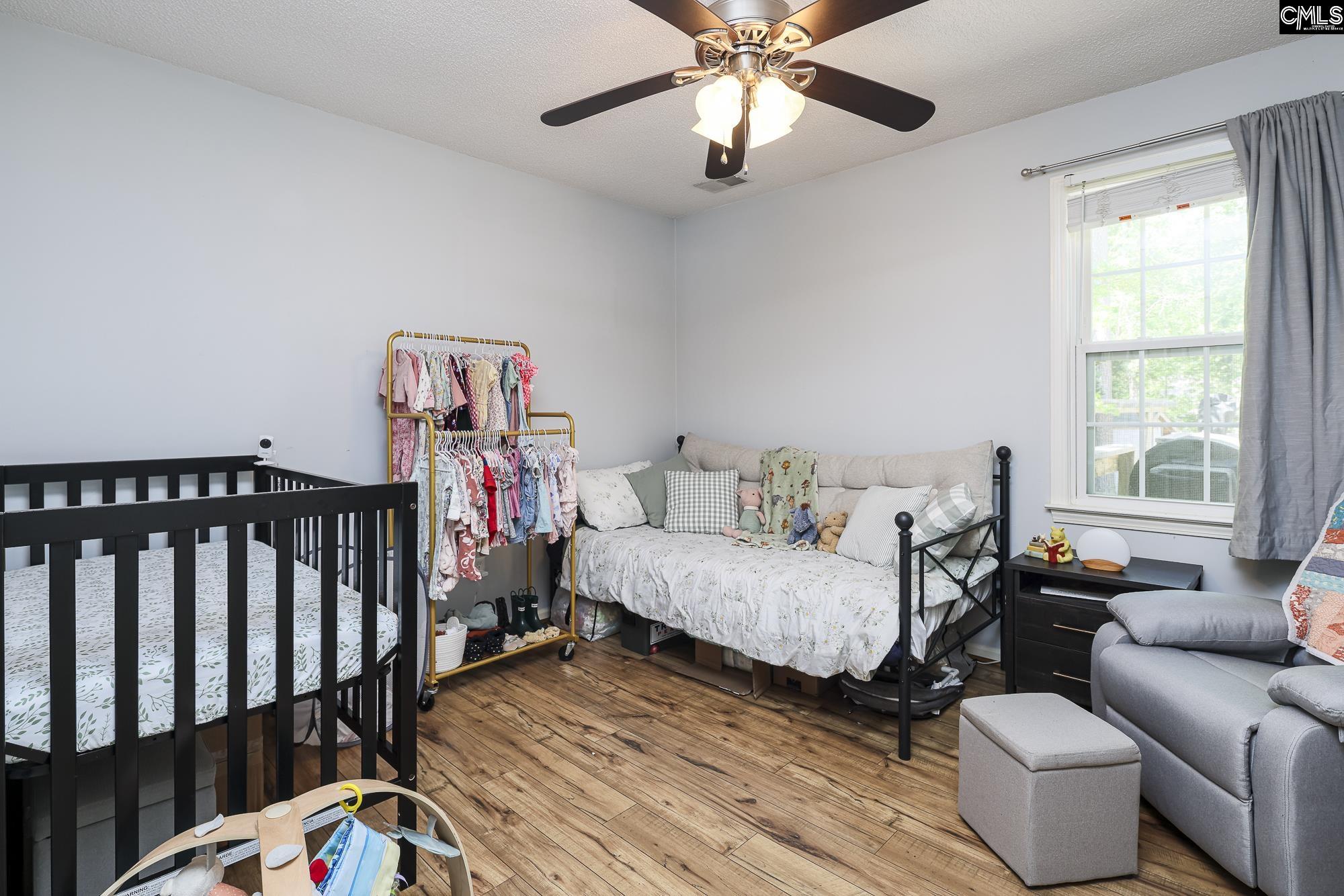 152 Thames Valley Court Irmo, SC 29063 - Photo 21 of 32 a bedroom with furniture and a window